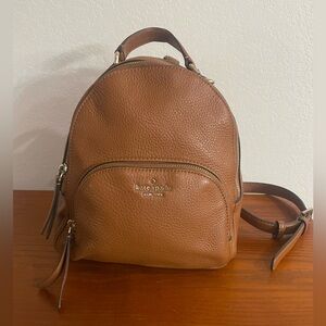 kate spade tan pebbled leather backpack with gold logo